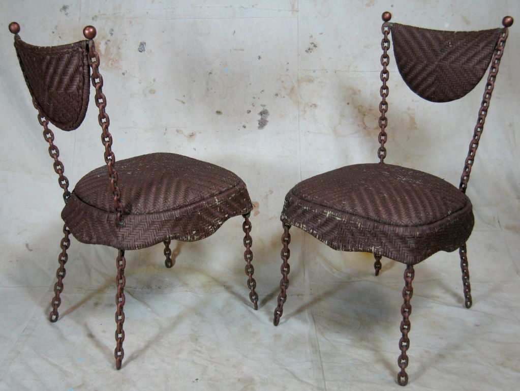 Pair chairs made with welded metal chains and woven leather seats