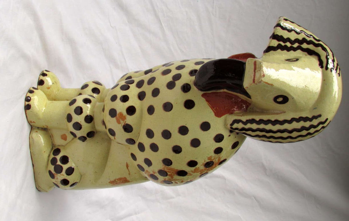 Slip decorated and glazed cubist poodle