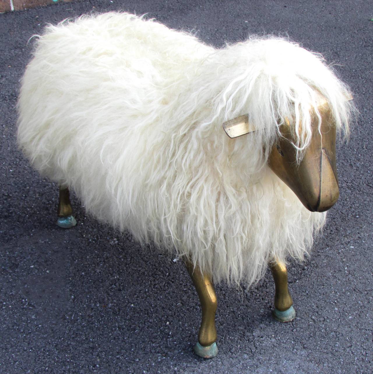 Sheepskin covered bench with bronze head and feet after FRANÇOIS-XAVIER LALANNE 