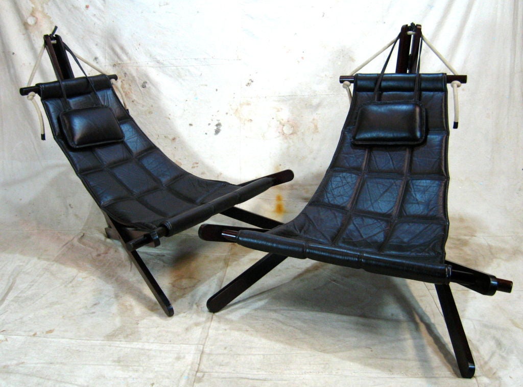 Pair intricate designed leather and wood sling chairs by English Architect Dominic Michaelis called the 