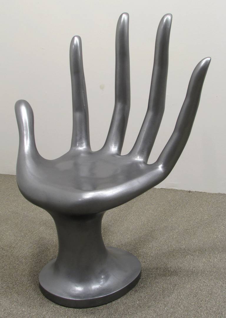 Surreal hand chair with elongated fingers
