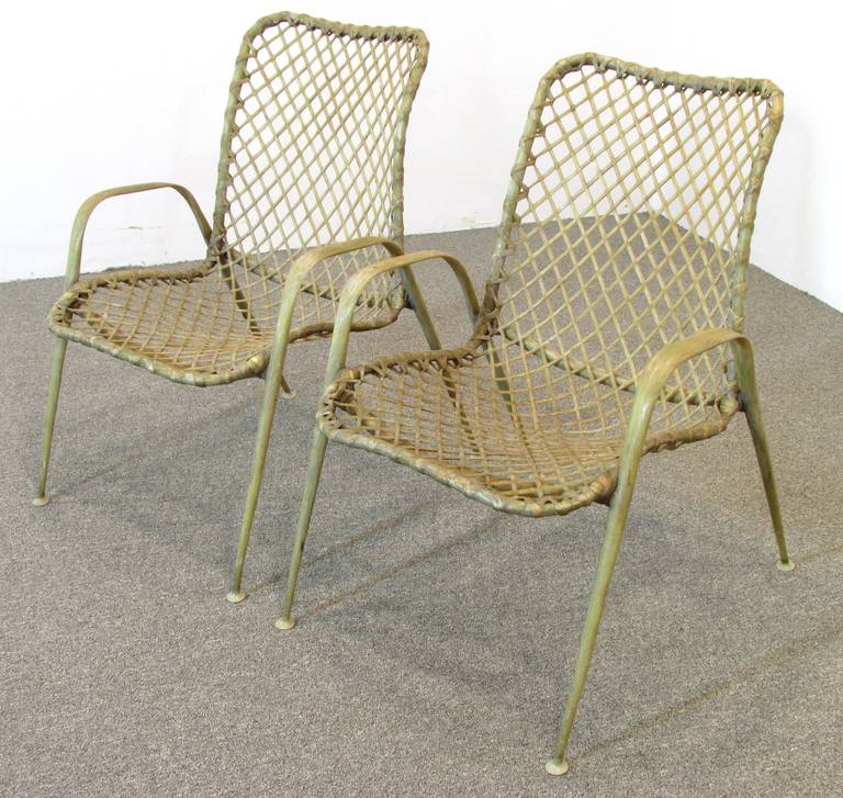 A pair of sculptural armchairs made of resin by Troy Sunshade Company.