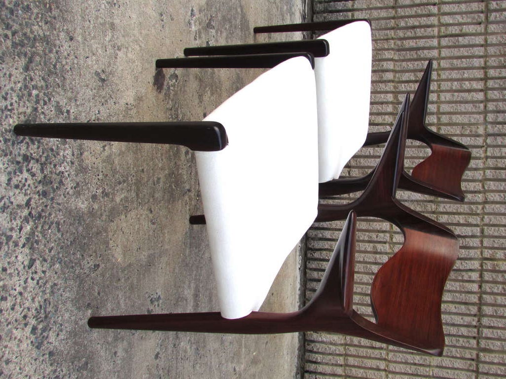 Very sculptural pair of rosewood armchairs designed by Arne Hovmand-Olsen and manufactured by J.O. Moller this is model number 55 from the 1950s