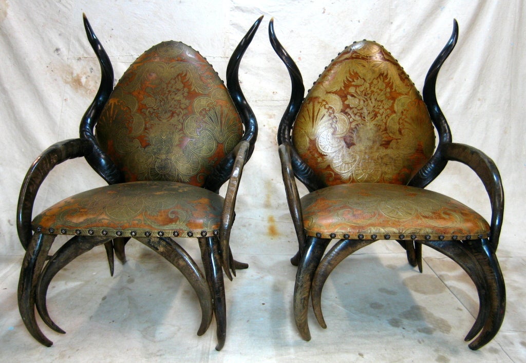 Pair trophy horn chairs from African safari with Florentine leather upholstery