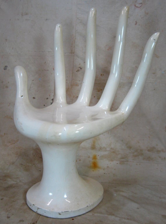 Surreal hand chair with elongated fingers