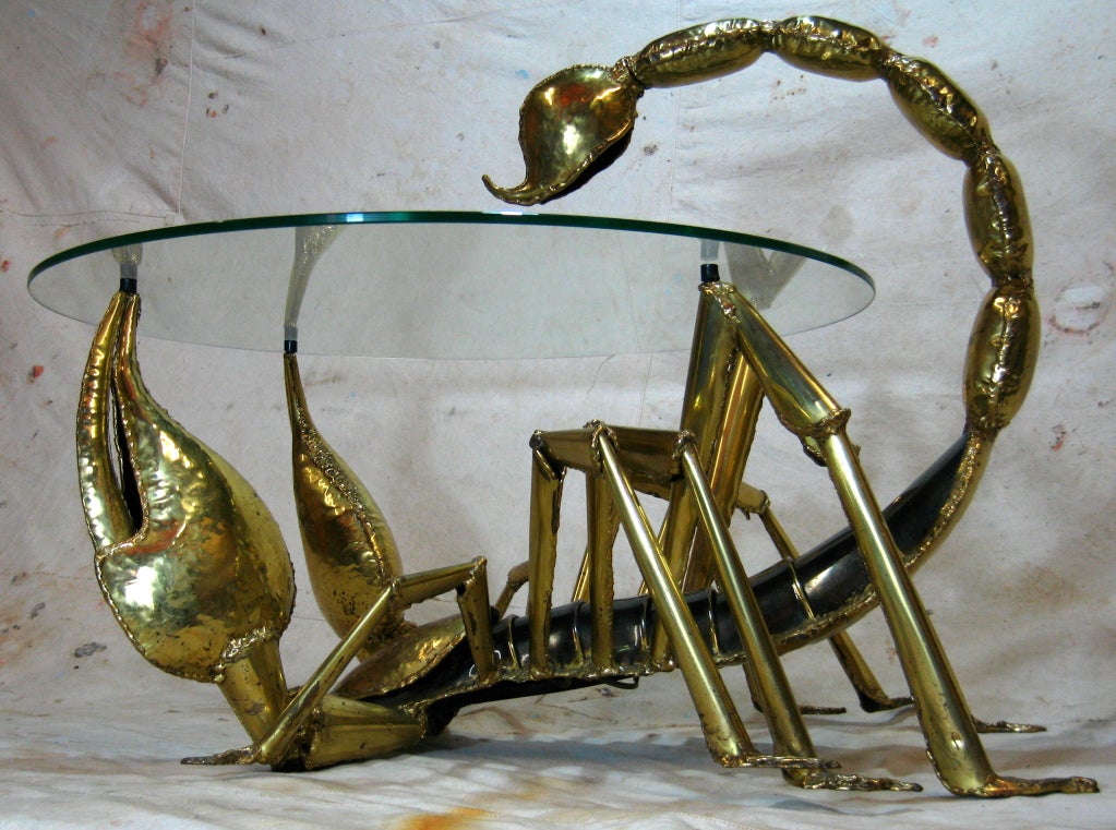 Sculpted brass scorpion cocktail table with glass top tip of tail has a light by Jacques Duval-Brasseur signed on bottom
