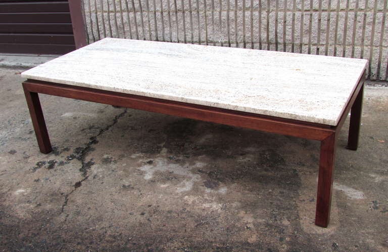 Beautiful classic cocktail table with travertine top over walnut base