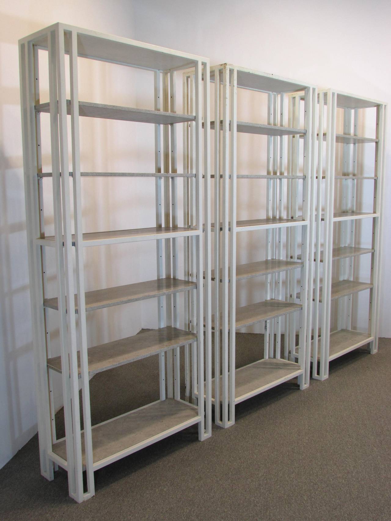 Painted metal etageres or bookcases by Billy Baldwin with marble shelves these were made by Luten Clarey Stern three avaliable