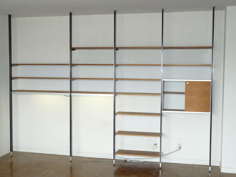 George Nelson Herman Miller CSS Shelving System. A very nice example in excellent condition. Configured with all parts as shown. Comes with two Herman Miller issue under the shelf fluorescent lamps. Top three shelves are not CSS, appear to be from a