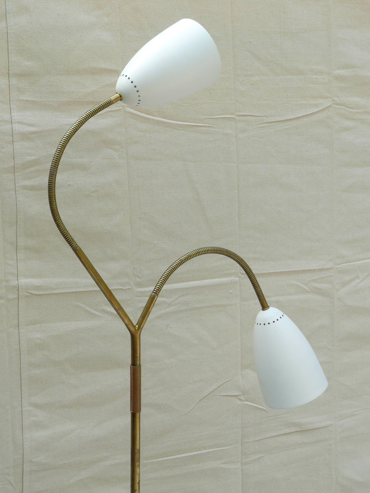 Rare Carl Auböck dual cone asymmetrical brass floor lamp.