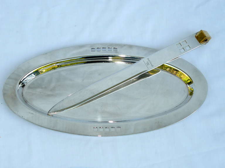 Silver plate letter opener and catch all tray by Richard Meier for Swid Powell. Both pieces are stamped made in Italy. The letter opener is adorned with a spinning gold plated cube at the top. The measurements given below are for the tray, the