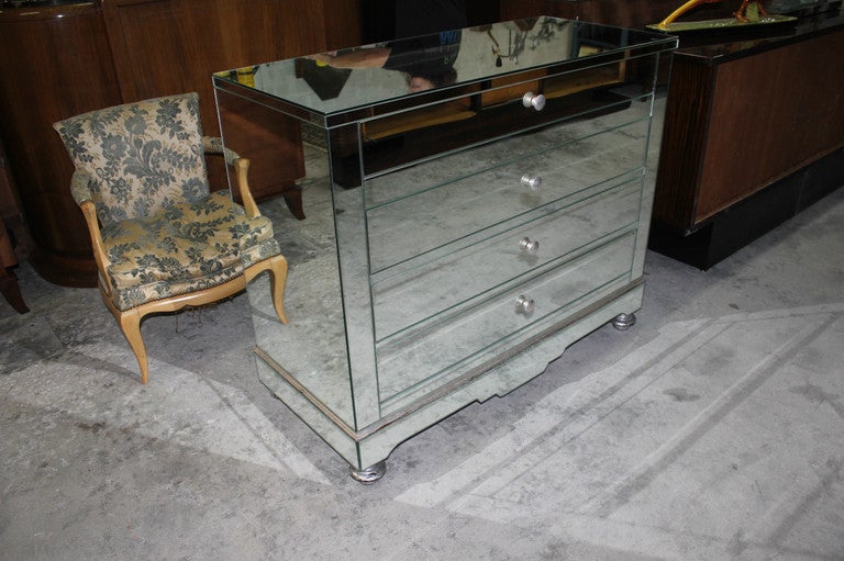 French Art Deco/ Mid Century 4 Drawer Mirrored Dresser. Silverleaf Detail on Knobs and Feet.