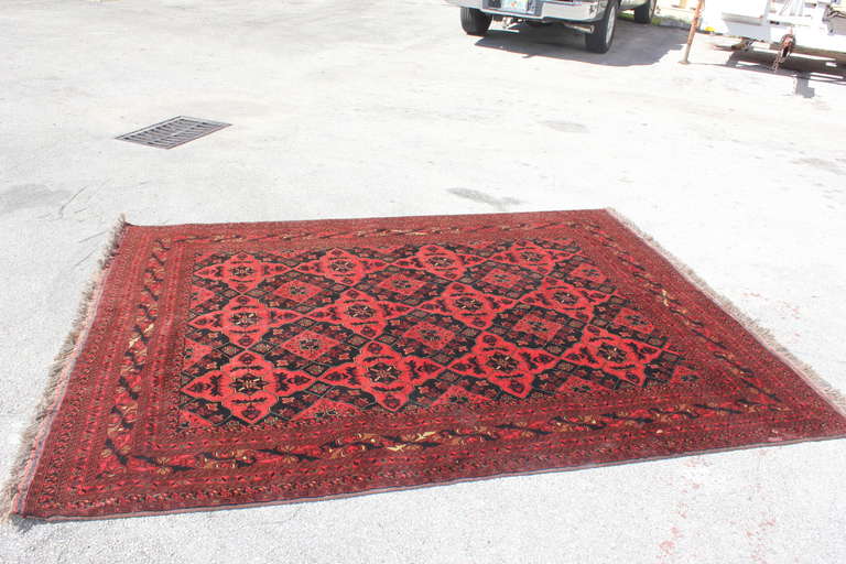 A 19th c. Persian Rug, Reds, Maroon, Black, Cream. We are not experts on rugs but can tell you this piece is in good condition, clean. Estate sale item, may need a professional cleaning.