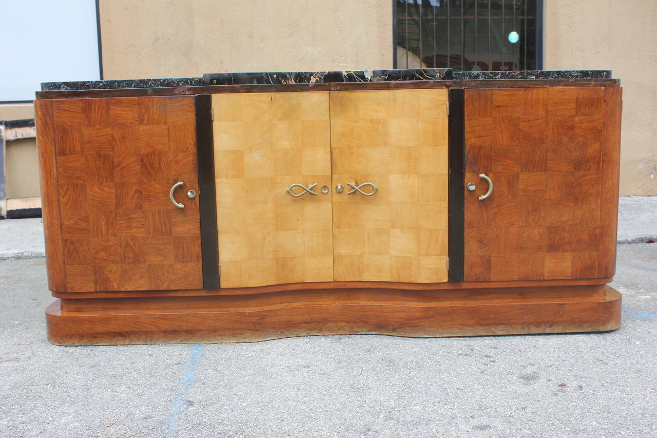 A stunning French Art Deco sideboard or buffet palisander and sycamore by tricoire marble top. Elegant hardward as is condition original finish the sideboard need too be refinish.