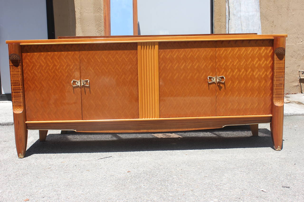 A French Art Deco mahogany parquetry buffet, circa 1940s. Interior finished.