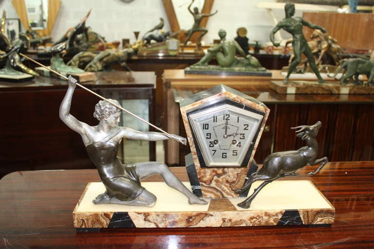 A French Art Deco Clock Sculpture Group of Woman with Spear and Deer, by Uriano.