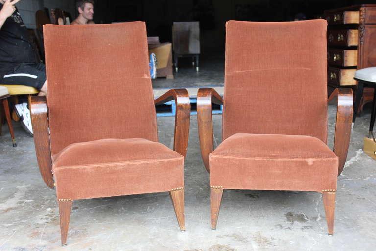 A Pair of French Art Deco Carved Walnut Club Chairs, circa 1940's. Reupholstery recommended.