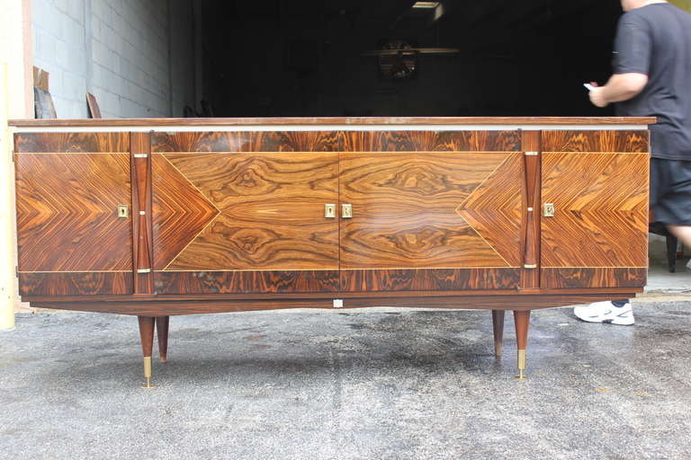 A French Art Deco exotic Macassar ebony buffet or sideboard, circa 1940s. Interior finished. Beautiful detail. All keys present, excellent condition.