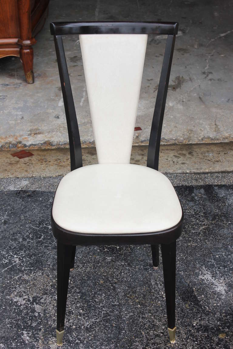 A set of 6 French Art Deco Ebonized Walnut Dining Chairs, circa 1940's. Reupholstery recommended.
