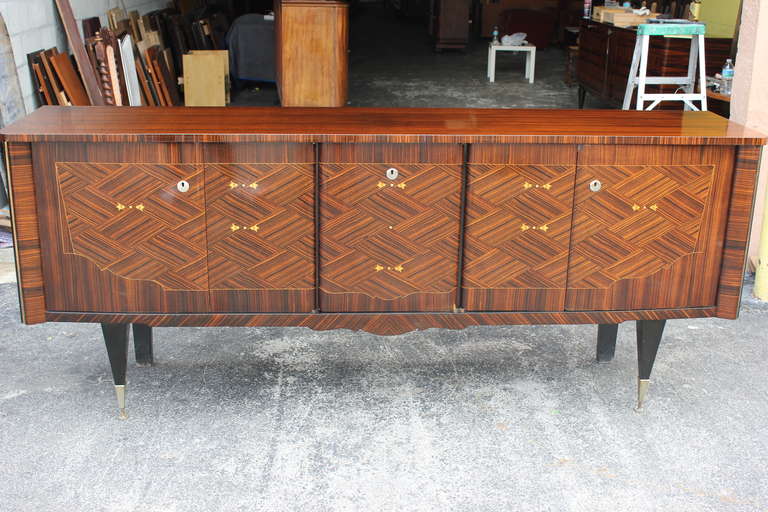 A French Art Deco/ Art Moderne Exotic Macassar Ebony Buffet, circa 1940's. Interior finished in Lemonwood. Excellent condition, all original keys present. Center bar area.