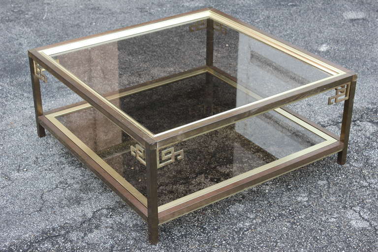 A Mastercraft Large Brass and Glass 2 Tier Coffee/ Cocktail Table, circa 1970's. Made in USA.