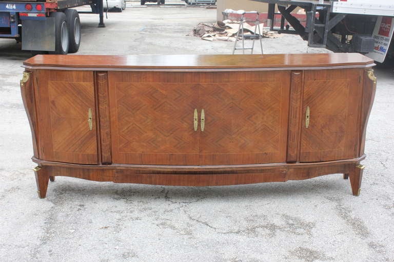 A French Art Deco Sideboard / Buffet Palisander , Bronze Adornments, Finished Interior. This piece will disassemble for elevator needs if necessary.circa 1940.