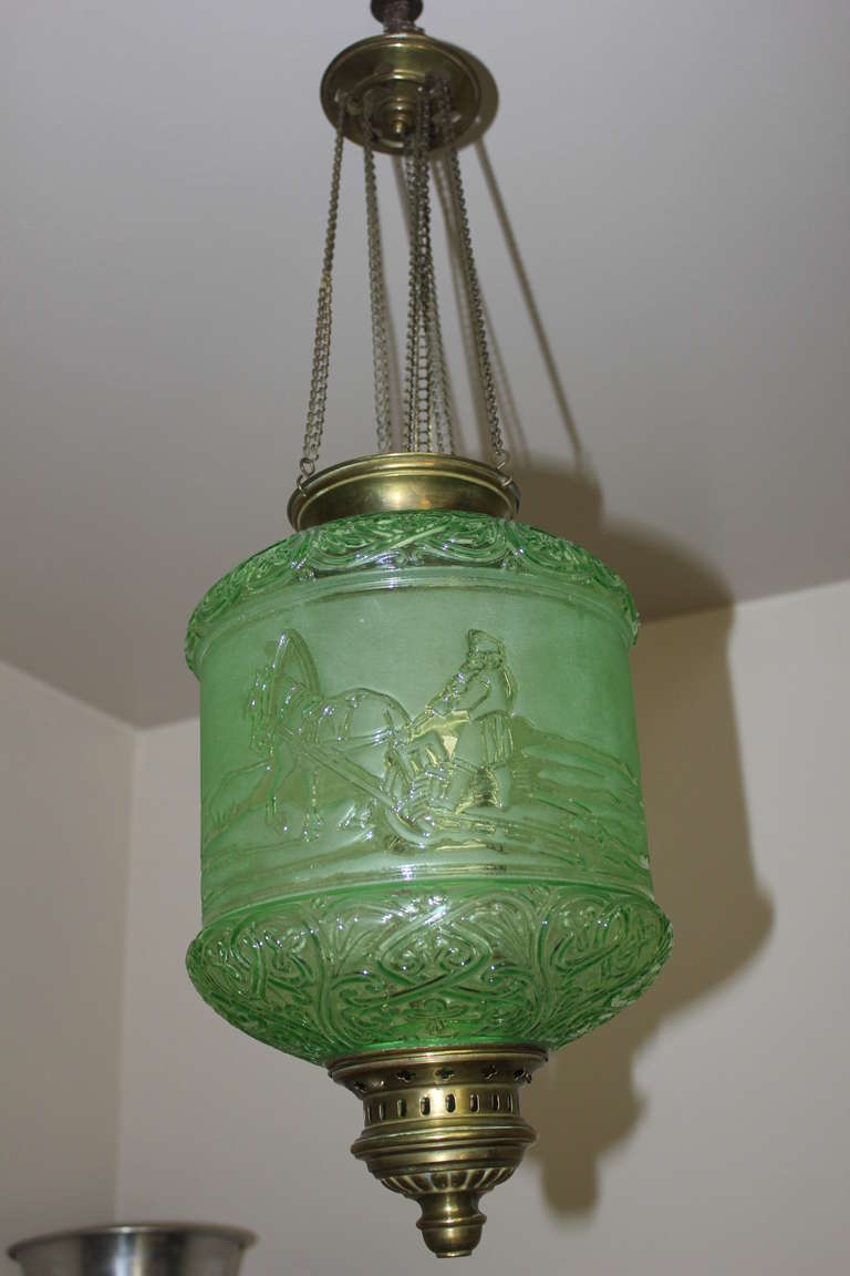A Truly Rare Emerald Green Electrified Oil Lantern Signed and Created by Baccarat France, 19th century, Napoleon III. A Scene Romanticising the Rugged Way of Life of the Siberian People. A Man on a Sleigh being pulled by a Horse, a Dog trailing