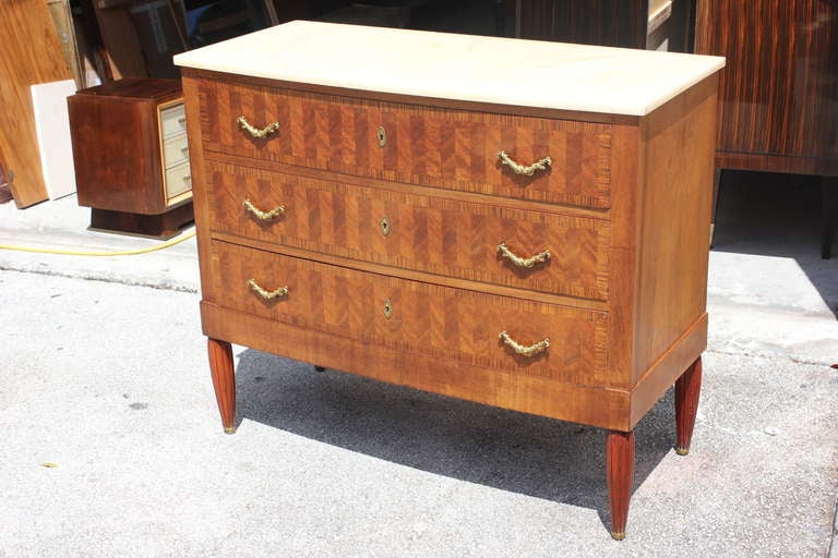 A French Art Nouveau Walnut Marquetry 3 Drawer Dresser with Bronze Pulls. White marble top.
