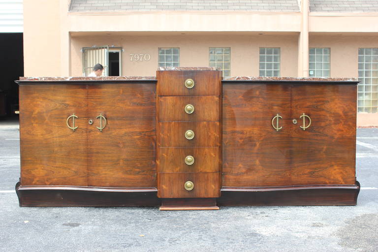 A grand scale French Art Deco sideboard or buffet Palissander. With marble top elaborate hardware, beautiful curves. This is a stunning sideboard. Centre line of drawers.(with the original finish very good condition. )
