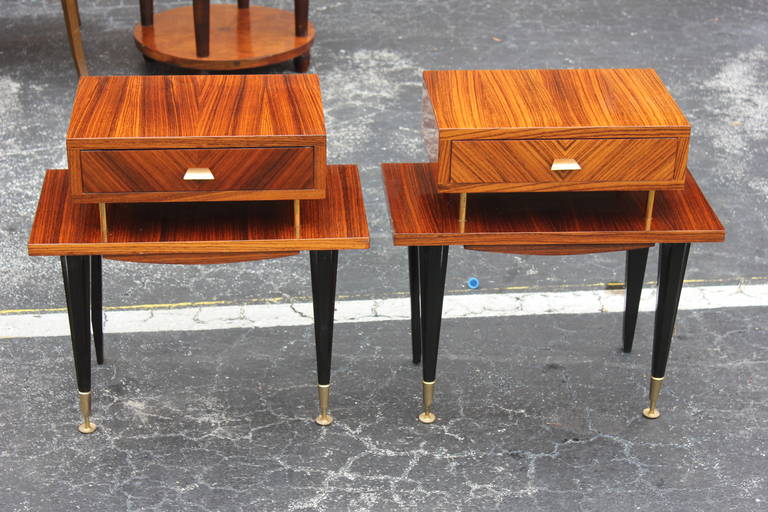A pair of French Art Deco Exotic Macassar Ebony Nightstands, circa 1940's.