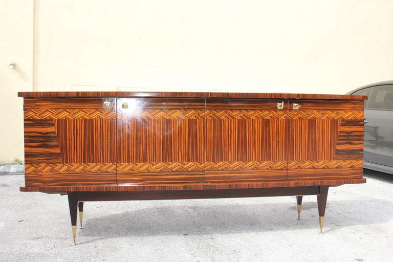 A French Art Deco exotic Macassar ebony buffet with stunning inlay detail. Interior finished in lemonwood.