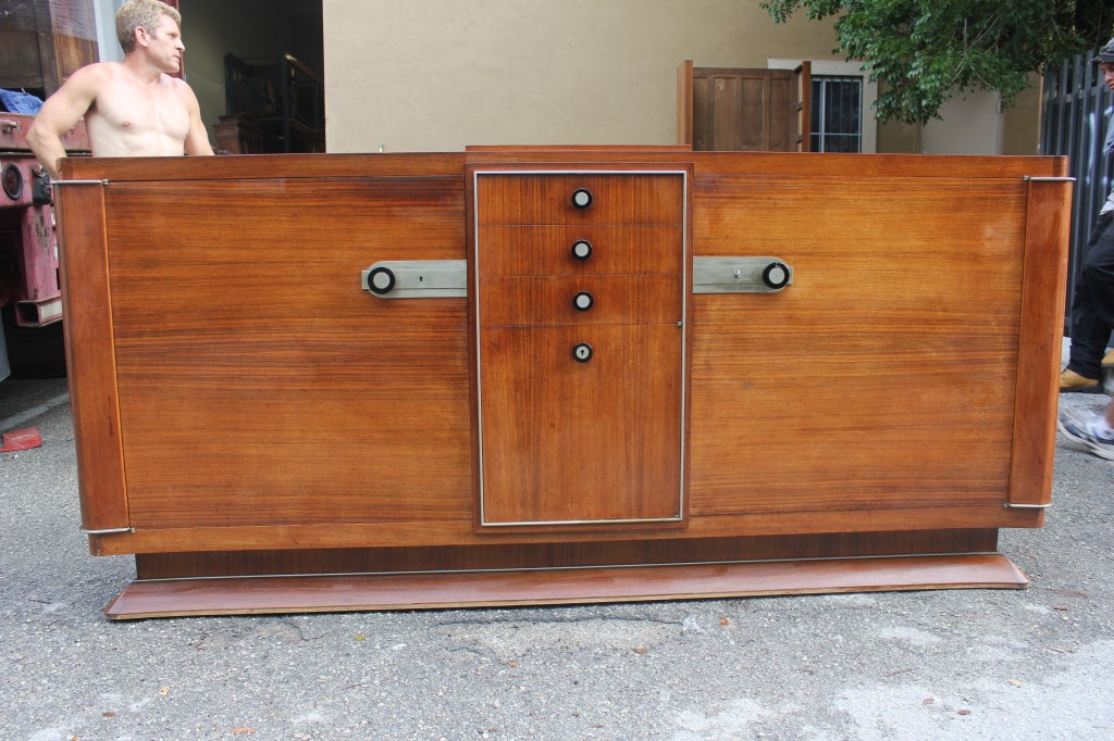 A masterpiece! Here is a French Art Deco documented palisander buffet by Dominique, circa 1930s. The book 