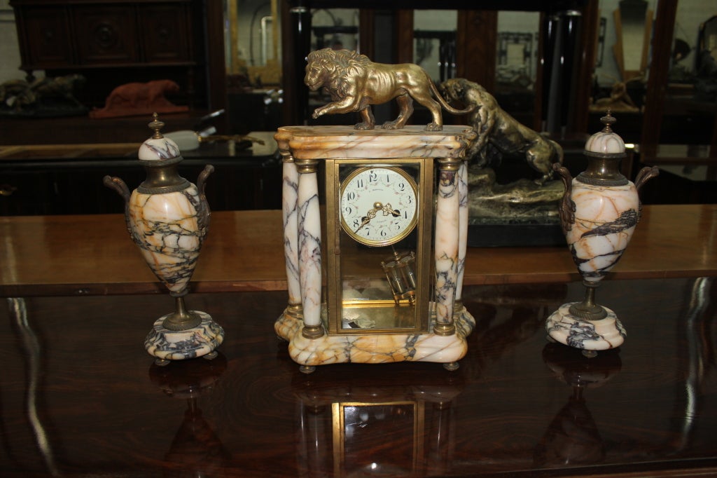 French art deco marble and spelter sculpture/ garniture of Lion atop Clock, excellent detail and craftsmanship.