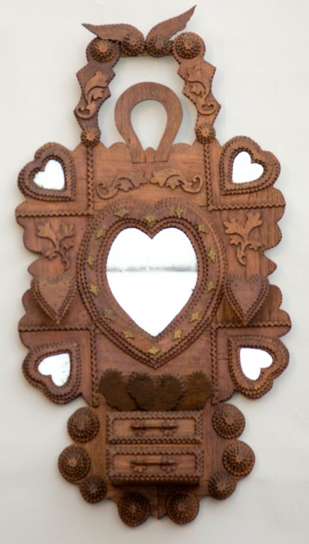 A unique Tramp art carving with hearts and horseshoe motifs, 
two drawers with hidden cubbies throughout. 
A truly original piece. 

