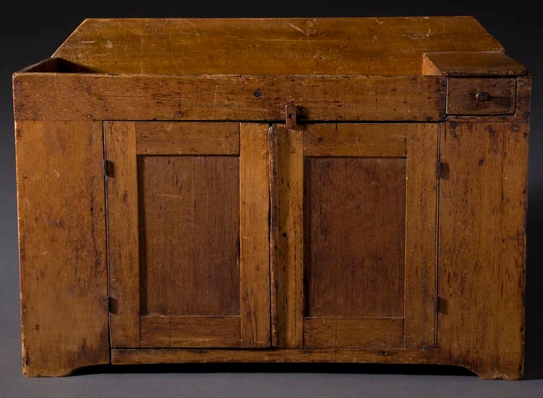 Original condition.
Two interior shelves and small drawer on upper right side.
Recessed panels doors. Recessed top with large back splash.
