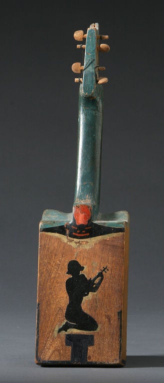 Unidentified maker<br />
Early 20th century.<br />
Wood and polychrome.<br />
Handmade fiddle with bobcat design painted on<br />
face.<br />
Ex Mendelsohn Collection.