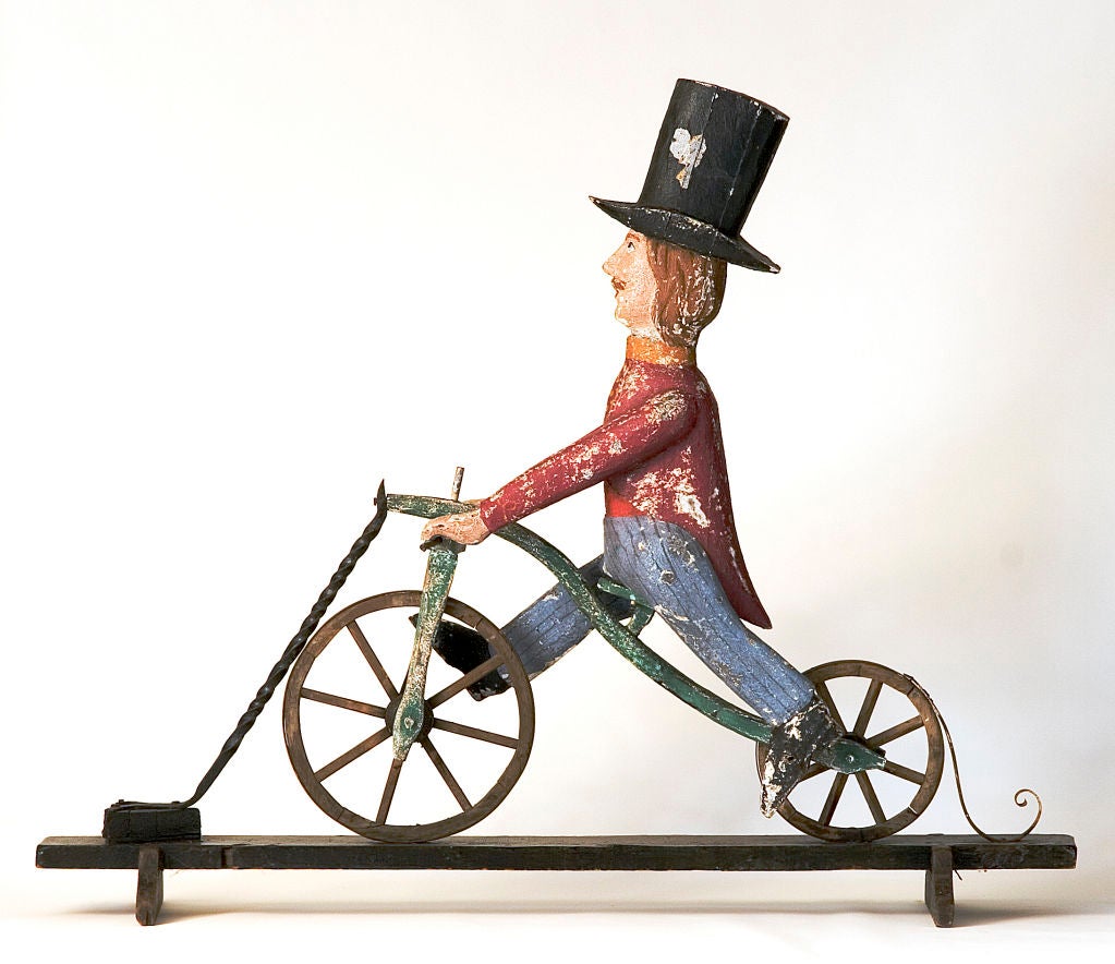 19th century
Wood, iron and polychrome.
Man made of jointed pieces of wood, wearing a colorful 1840-1850's livery and a top hat. Iron is all hand forged.