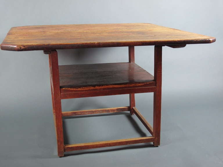 Two plank scrub top with cut ends.  Nice red over wash surface.  Hutch top tilts and secures with pegs to create a chair.