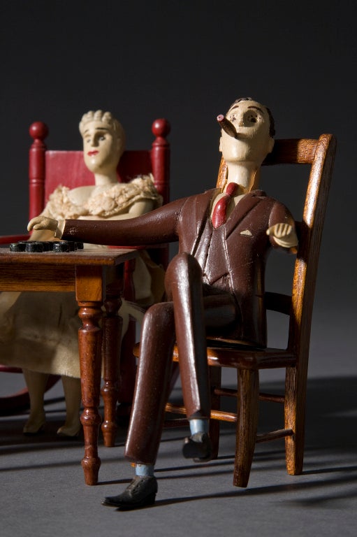 Three Figures Playing Checkers