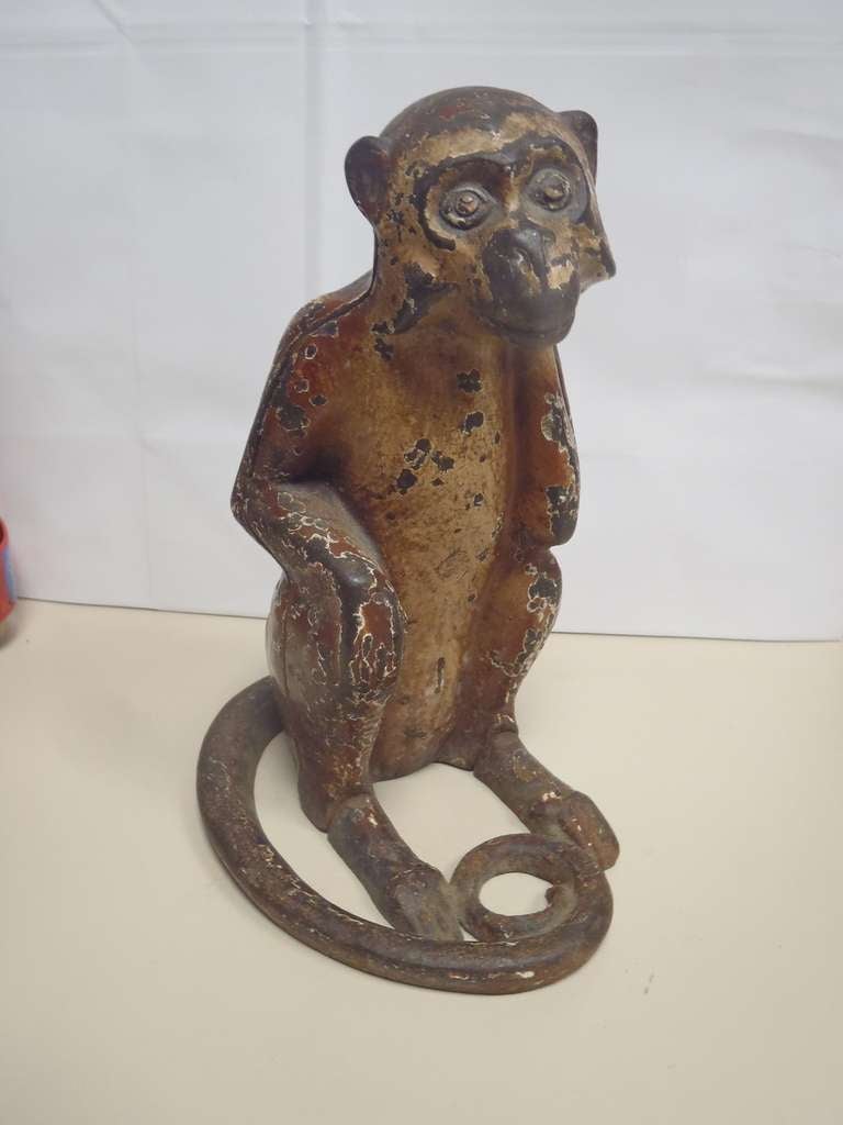 Antique cast iron doorstop, ca. 1930. Measures 8 7/8” tall x 4 5/8” wide. Made by Hubley and is full-figure. Three piece casting. 