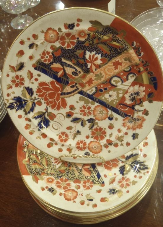 A set of 12 Ridgway in Staffordshire Old Derby dessert plates in the classic bold Imari pattern. The Backstamp is the 