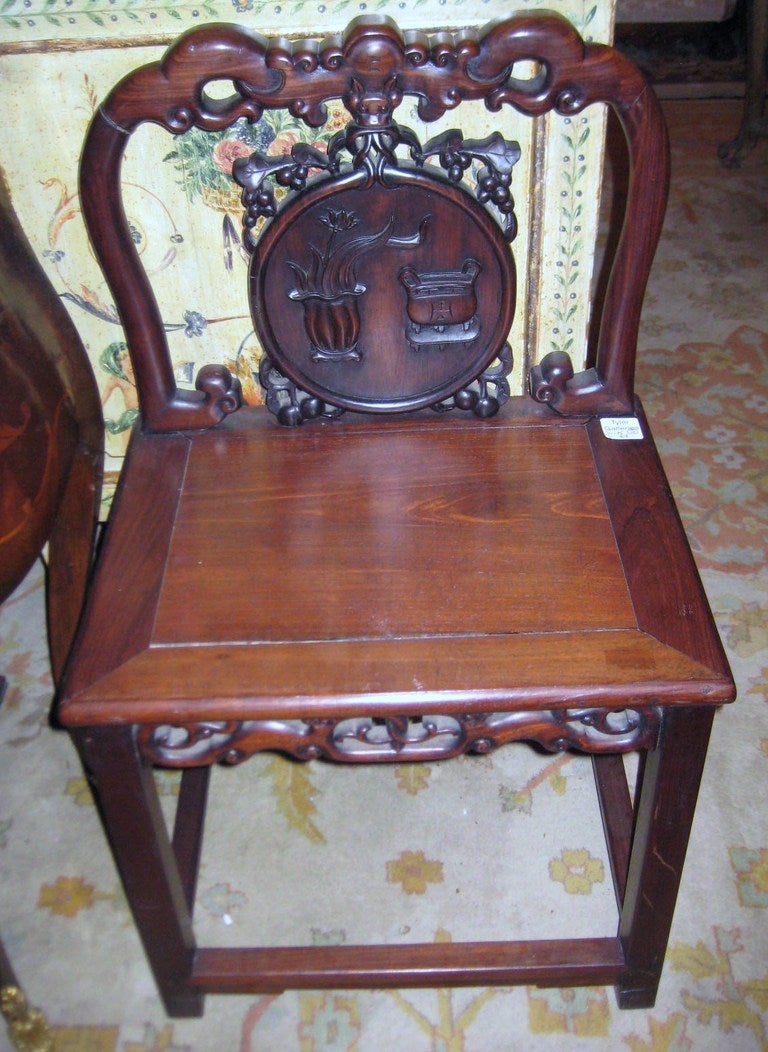 Pair of Chinese carved Zitan wood chairs, beautifully carved backrests with precious objects.