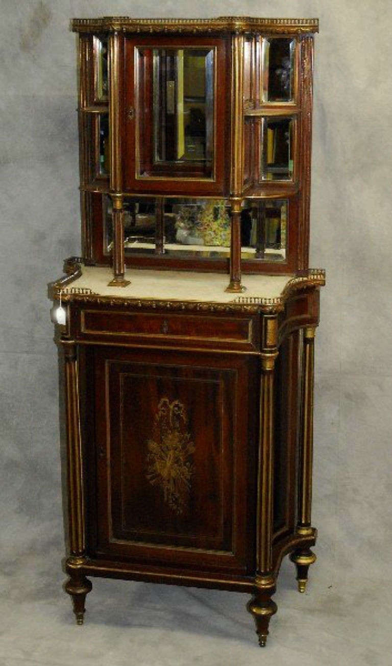 Louis XVI mahogany and bronze mounted two-part vitrine cabinet; the upper section centering a mirrored cabinet door flanked by four mirror backed shelves above the lower section with a shaped rectangular marble top with bronze gallery rail over a