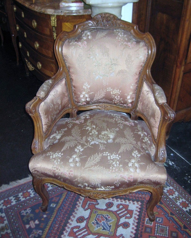 Pair of Louis XV Carved Walnut Bergeres
