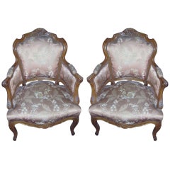Pair of Louis XV Carved Walnut Bergeres