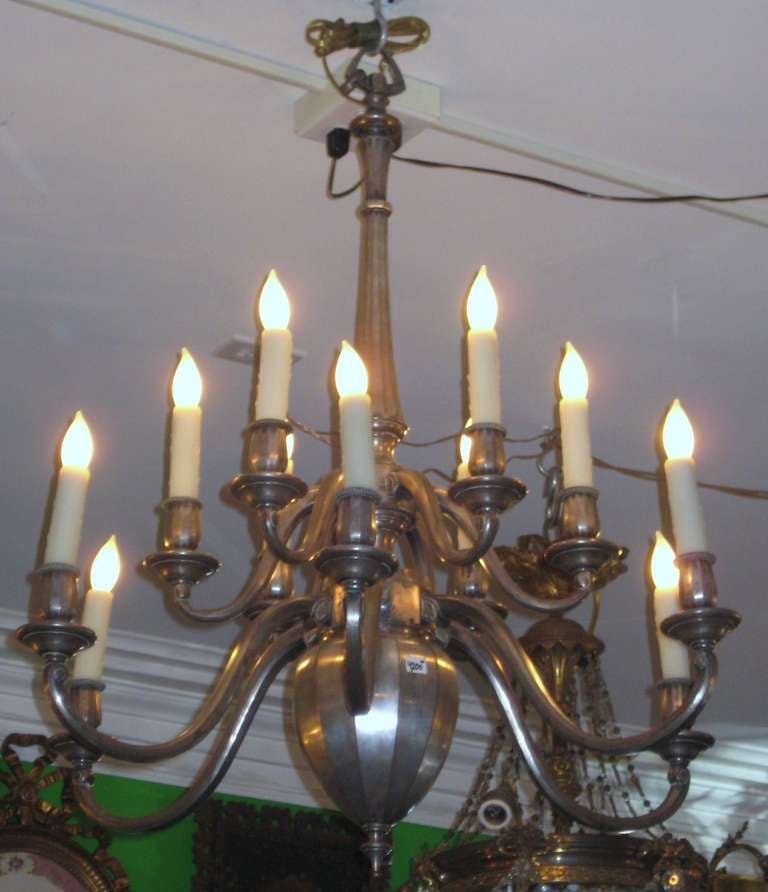 Silvered bronze two-tier twelve-light chandelier.