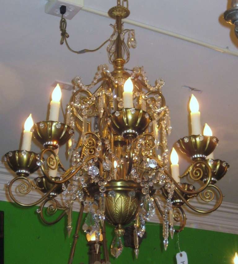 Maison Jansen eight-light bronze and crystal chandelier; the bronze frame ornamented with crystal beads, rosettes, balls, spikes, pendalogues and beaded crystal bobeche.

After 43 years of business we are retiring. Everything must be sold. Many of