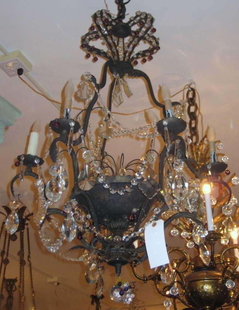 Beautiful Iron and Crystal Six Light Chandelier, ornamented with colorless  beads and prismatic pendalogues, the ball with attached amethyst and colorless crystal grapes; the crown-form corona decorated with amethyst ball crystals.