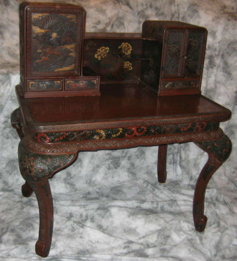 Japanese carved and lacquered desk referred to as Kamakura-bori lacquer.

Note: Kamakura-bori is a style of hand carving a pattern in wood and then finishing with lacquer.