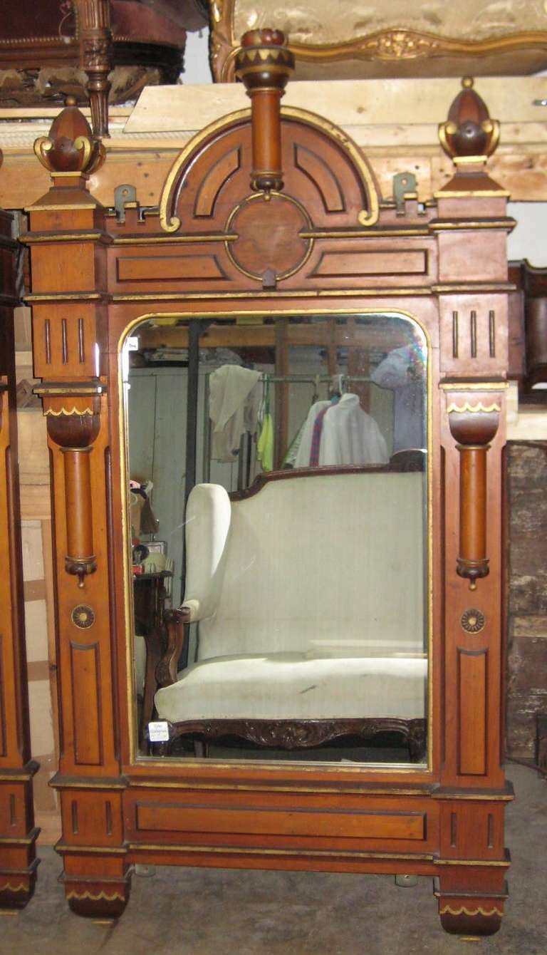 Pair of Gothic carved oak and parcel-gilt mirrors.